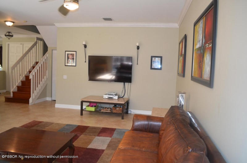 9506 Fox Trot Lane Boca Raton, FL 33496 - Photo 8 of 26 a living room with furniture and a flat screen tv