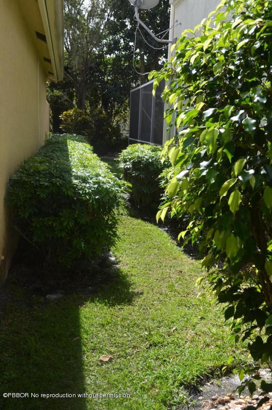 9506 Fox Trot Lane Boca Raton, FL 33496 - Photo 10 of 26 a backyard of a house with lots of green space