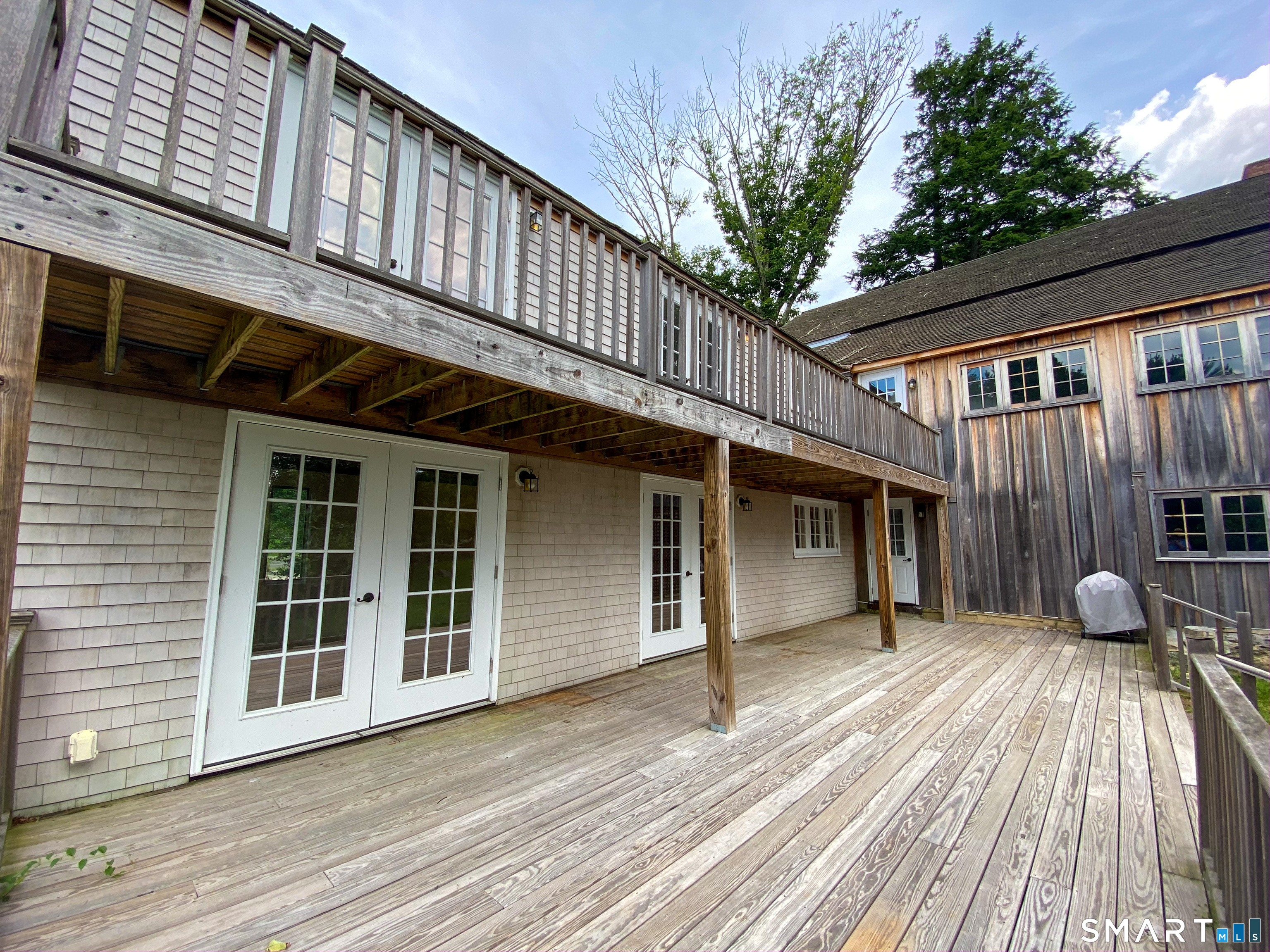 165 Drum Hill Road, Unit A Wilton, CT 06897 - Photo 19 of 24 a view of a house with a balcony