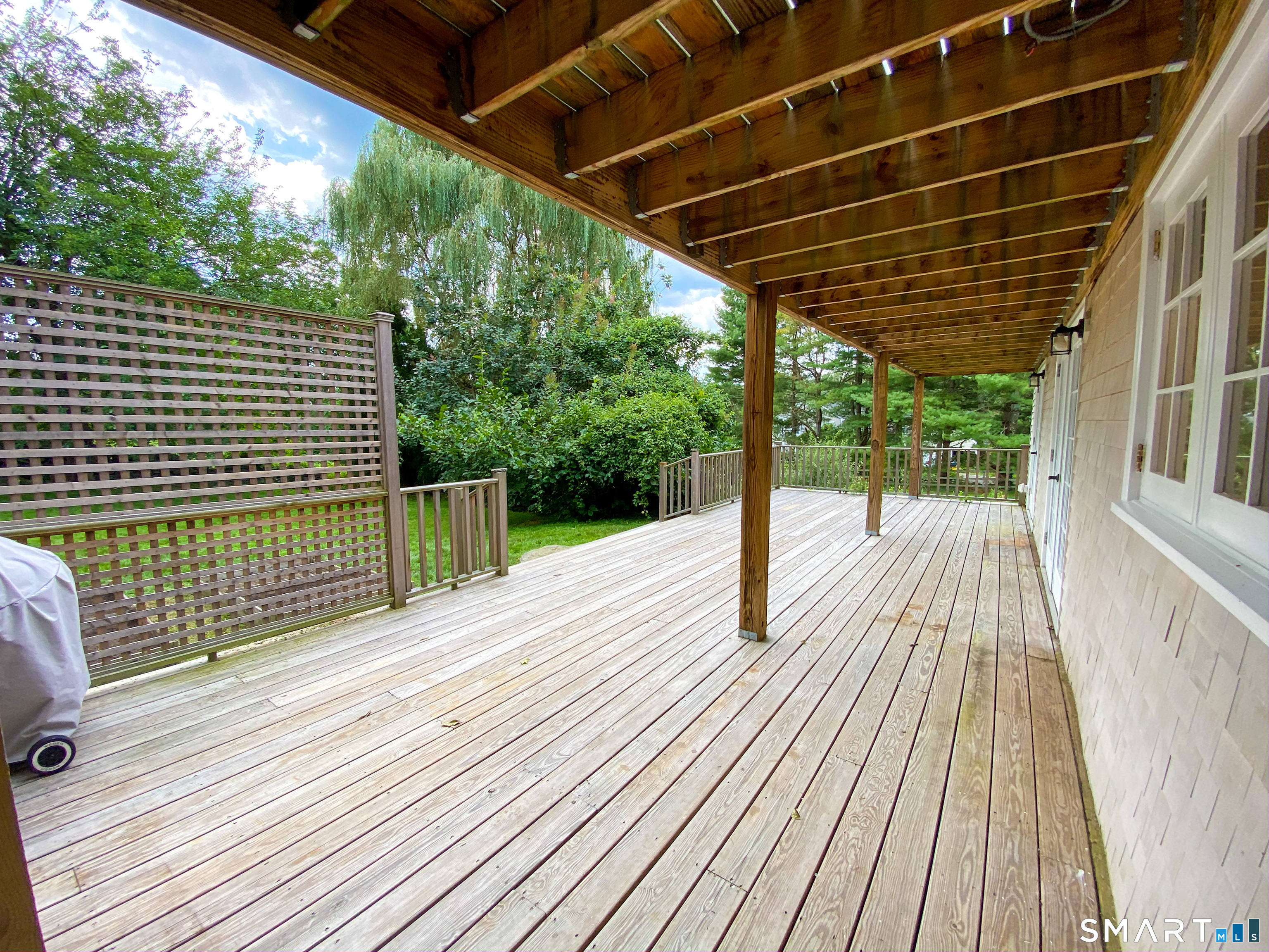 165 Drum Hill Road, Unit A Wilton, CT 06897 - Photo 20 of 24 a view of outdoor space with wooden deck