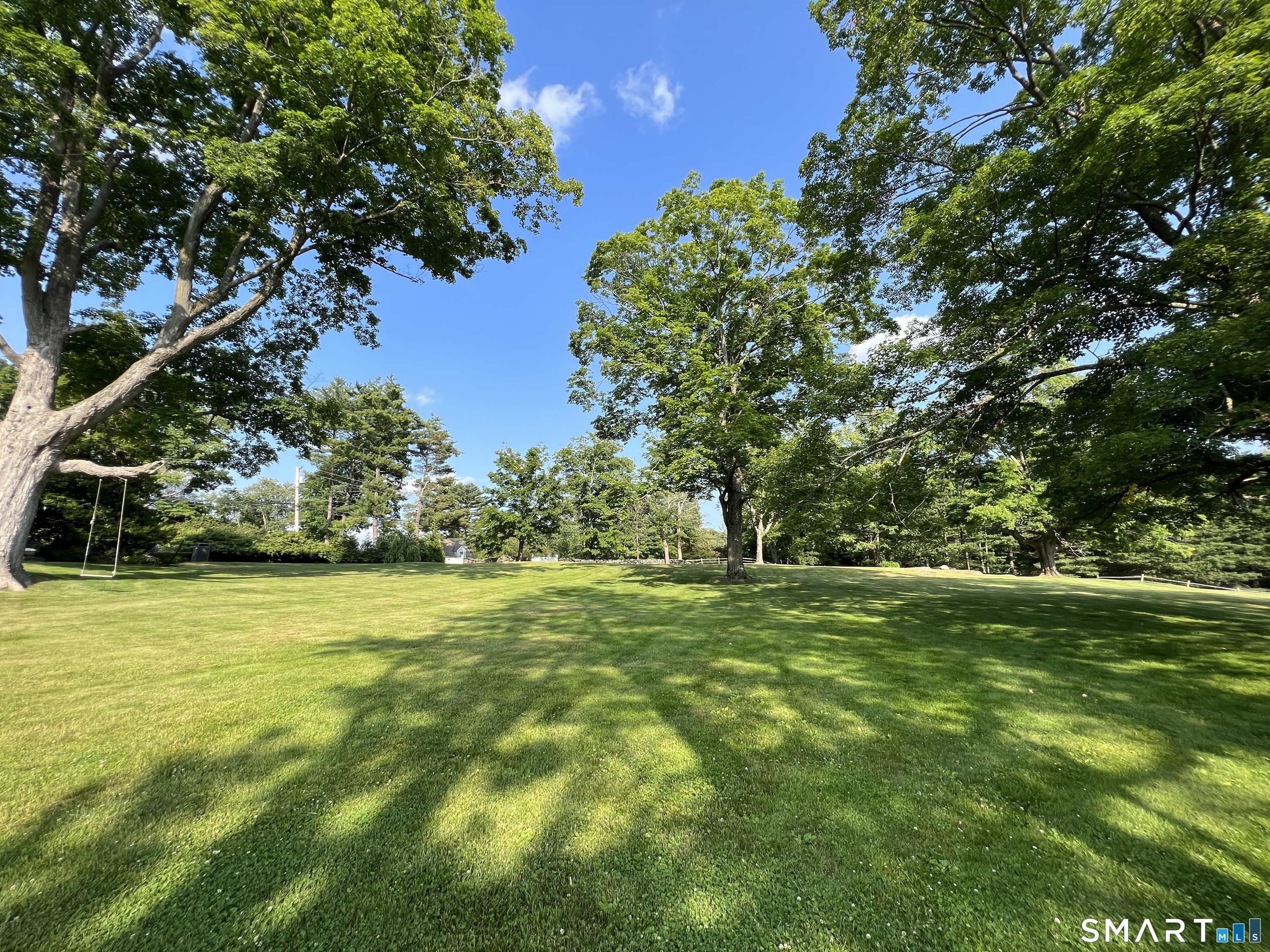 165 Drum Hill Road, Unit A Wilton, CT 06897 - Photo 22 of 24 a big yard with lots of green space