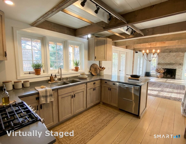 165 Drum Hill Road, Unit A Wilton, CT 06897 - Photo 4 of 24 a kitchen with stainless steel appliances a sink a stove and a refrigerator