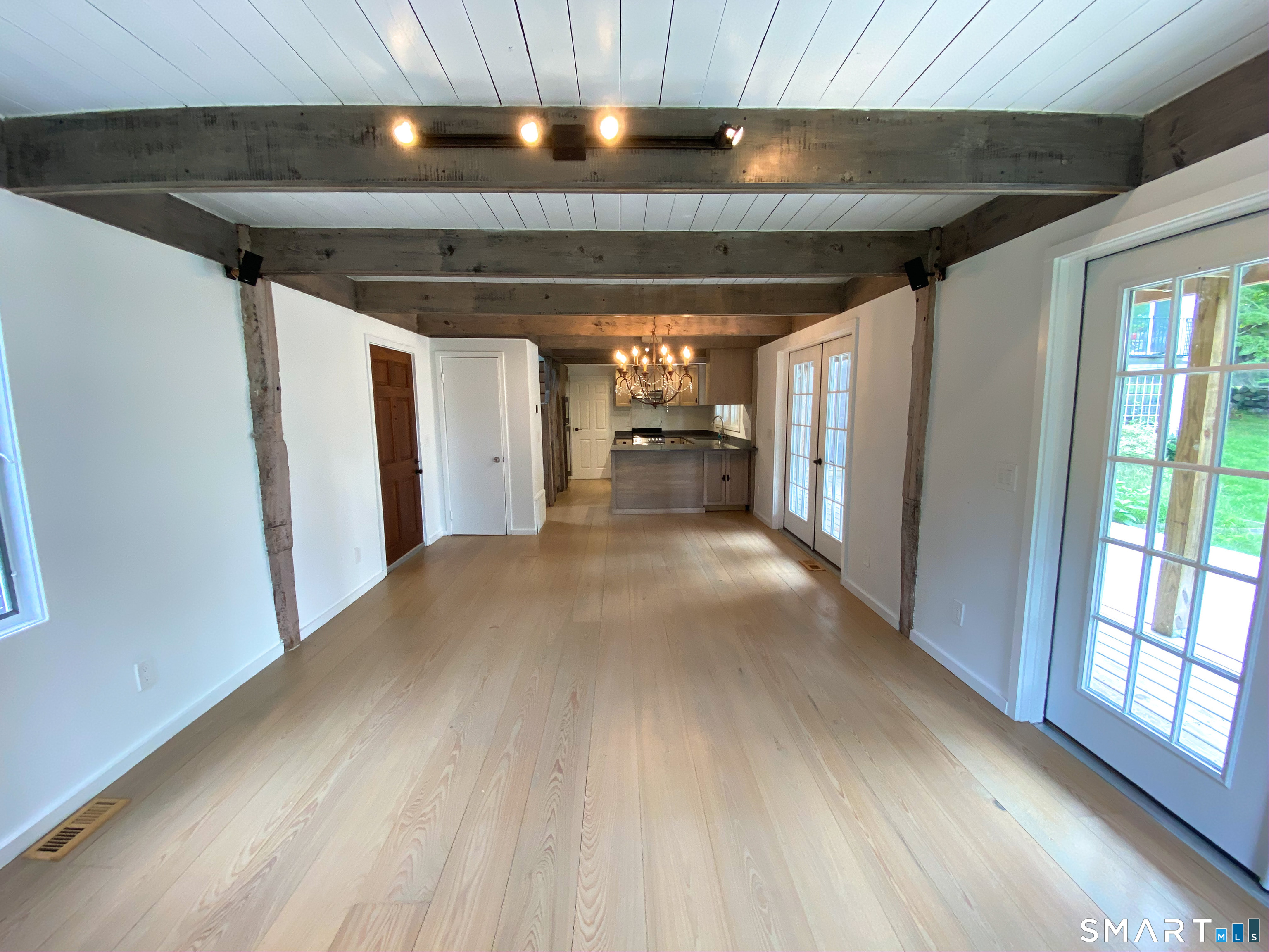 165 Drum Hill Road, Unit A Wilton, CT 06897 - Photo 9 of 24 a view of hallway and hall with wooden floor