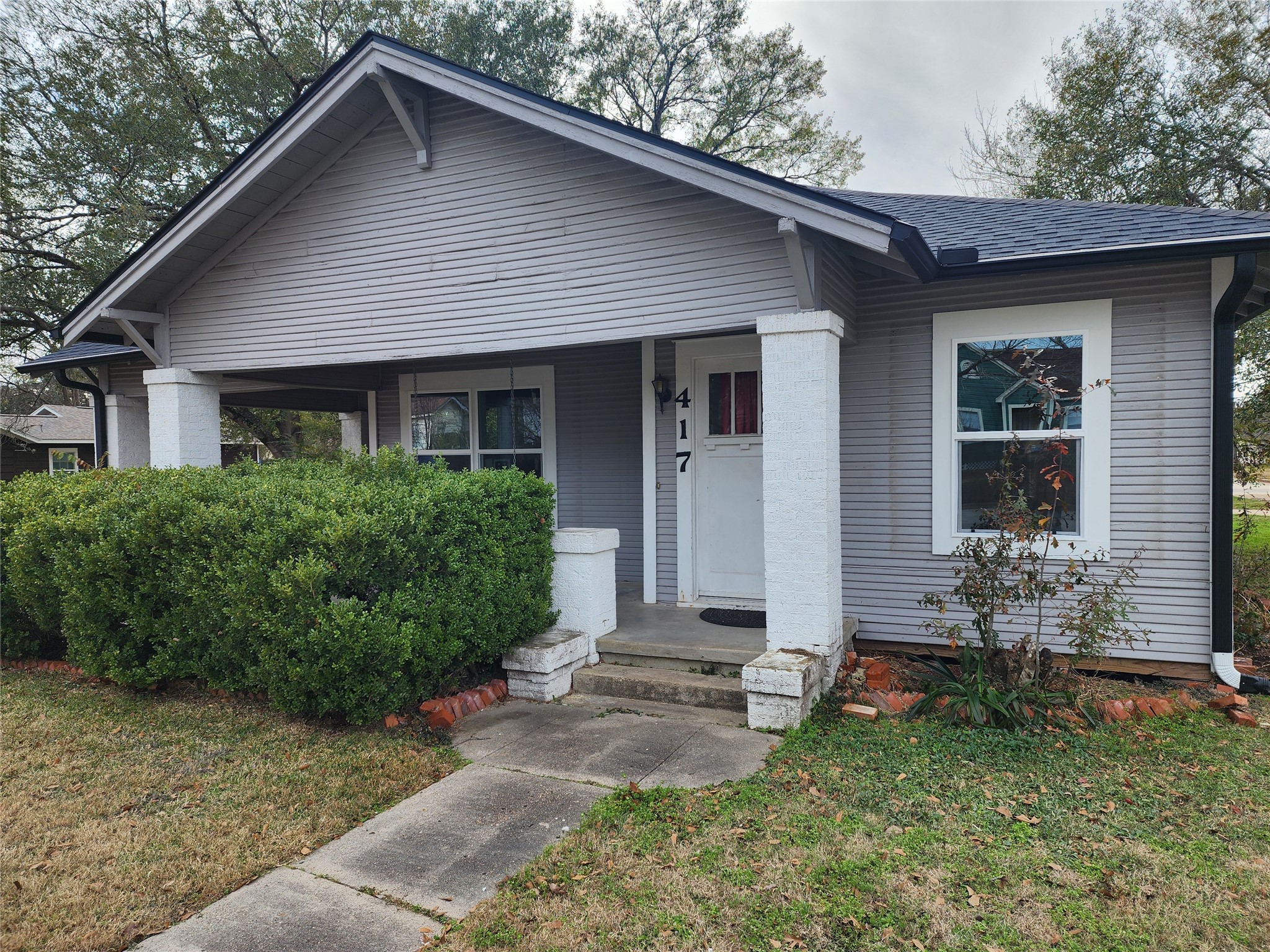 417 Victoria Street Navasota, TX 77868 - Photo 1 of 18 a front view of a house with a yard