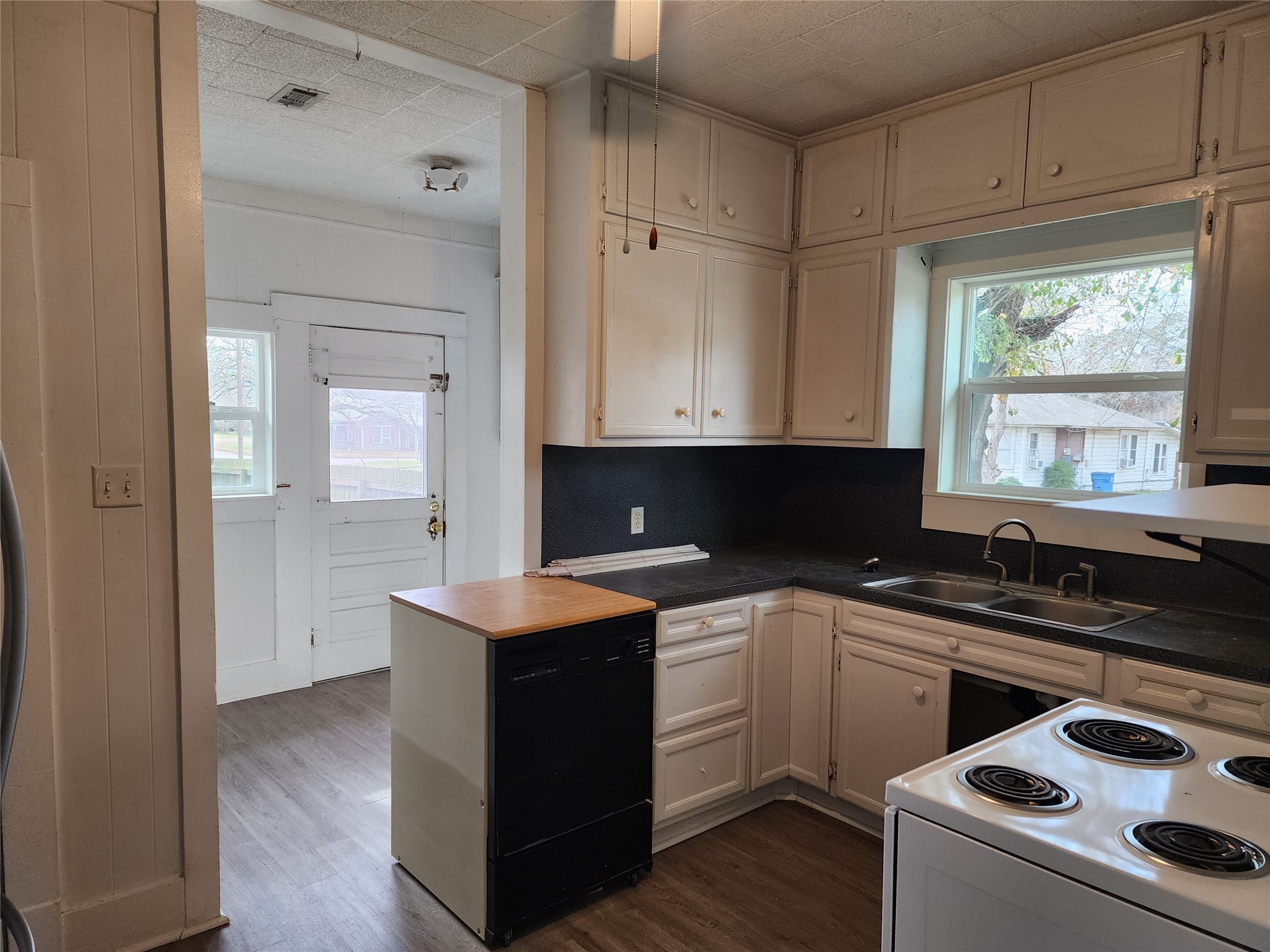 417 Victoria Street Navasota, TX 77868 - Photo 12 of 18 a kitchen with a sink stove and cabinets