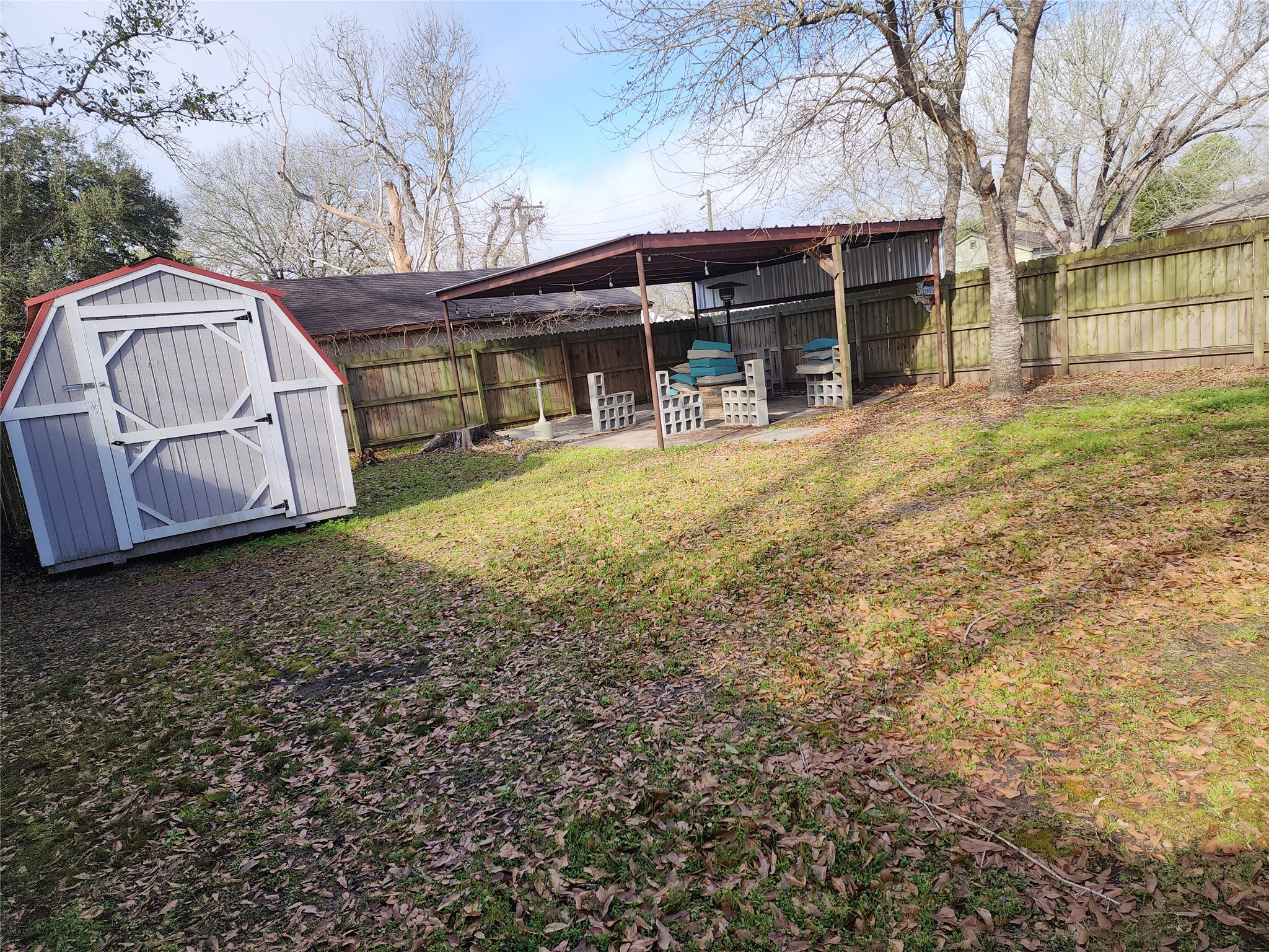 417 Victoria Street Navasota, TX 77868 - Photo 18 of 18 a view of a house with a yard and sitting area