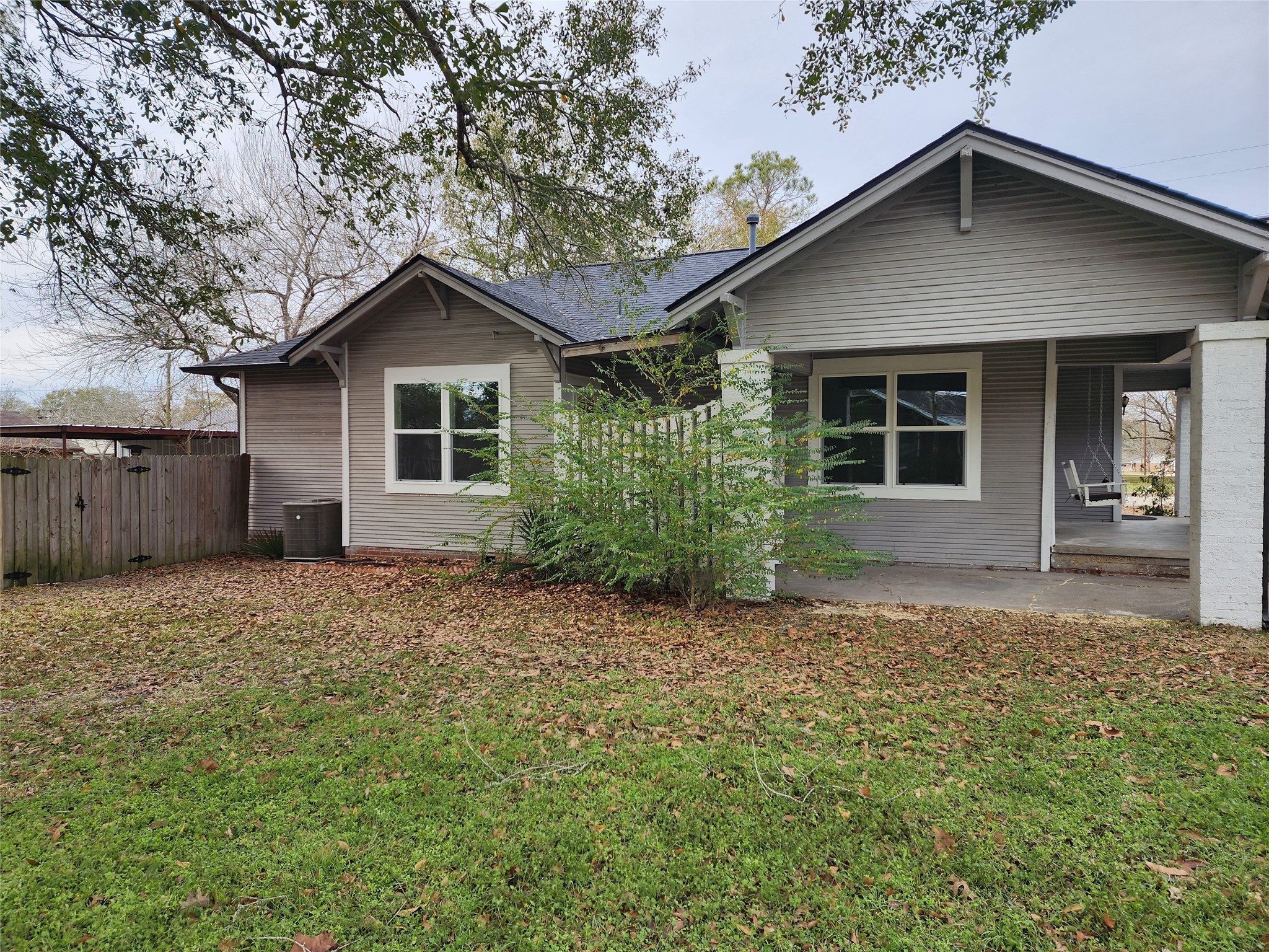 417 Victoria Street Navasota, TX 77868 - Photo 5 of 18 a house with trees in the background