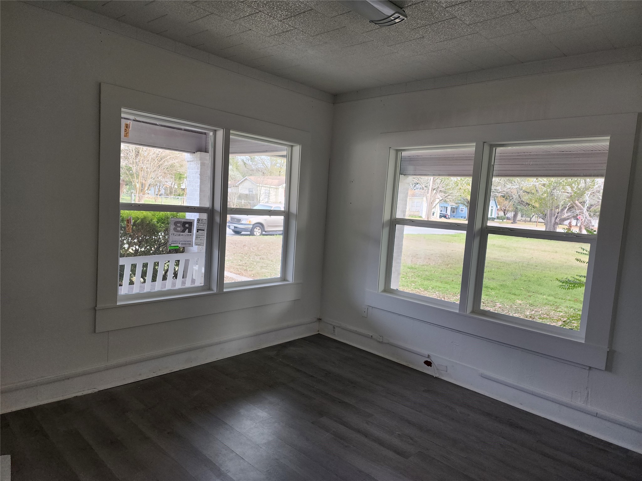 417 Victoria Street Navasota, TX 77868 - Photo 8 of 18 a view of an empty room with wooden floor and a window