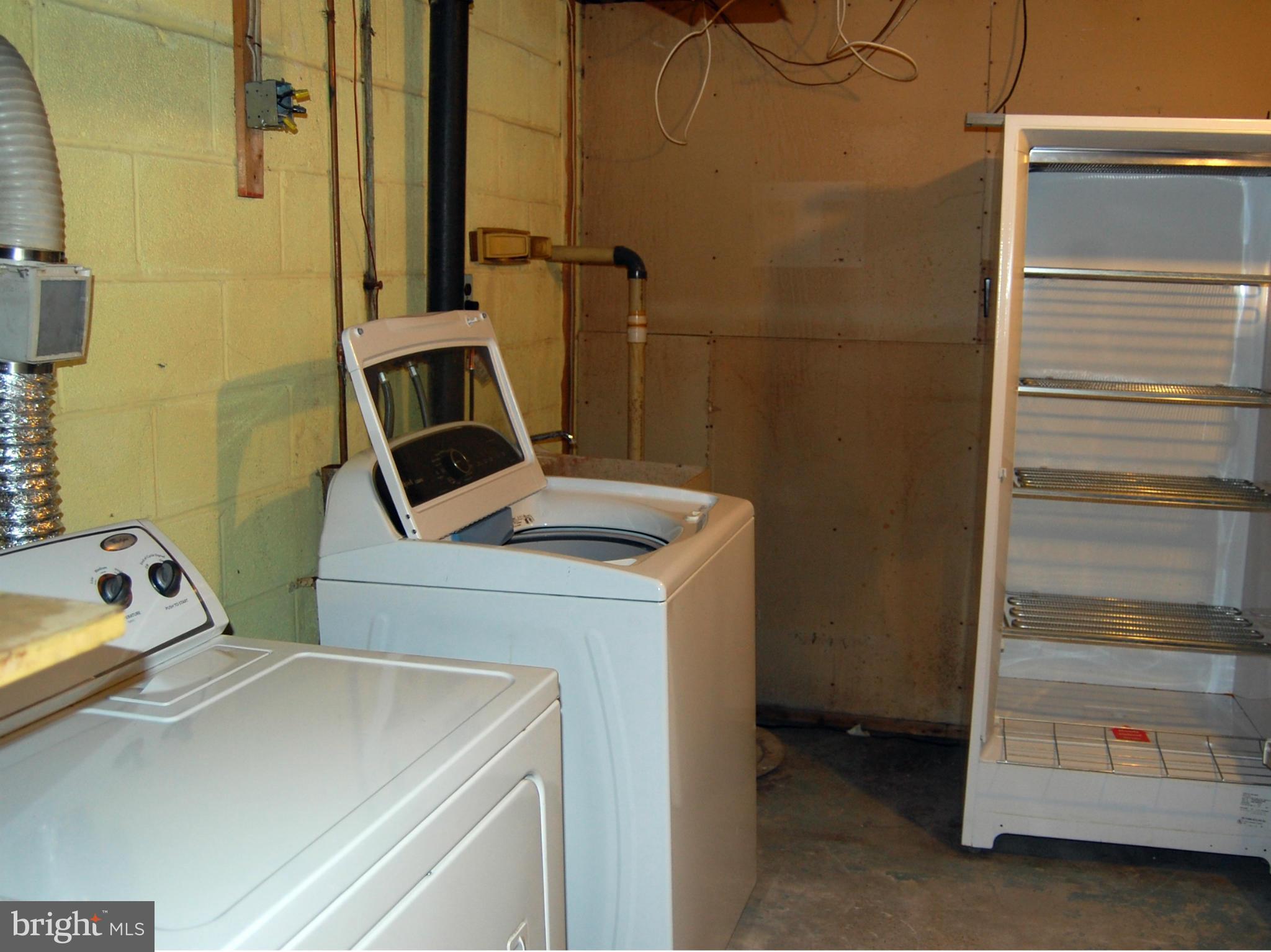 1319 Ava Road Severn, MD 21144 - Photo 25 of 29 Utility Room w/ Washer, Dryer and Freezer