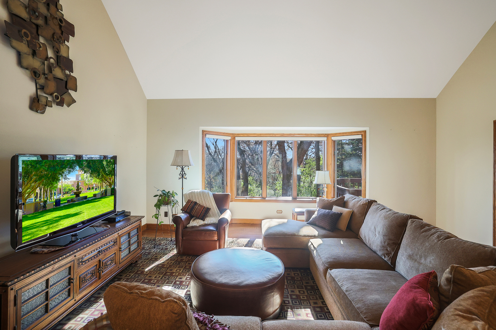 437 High Road Cary, IL 60013 - Photo 11 of 48 a living room with furniture and a flat screen tv