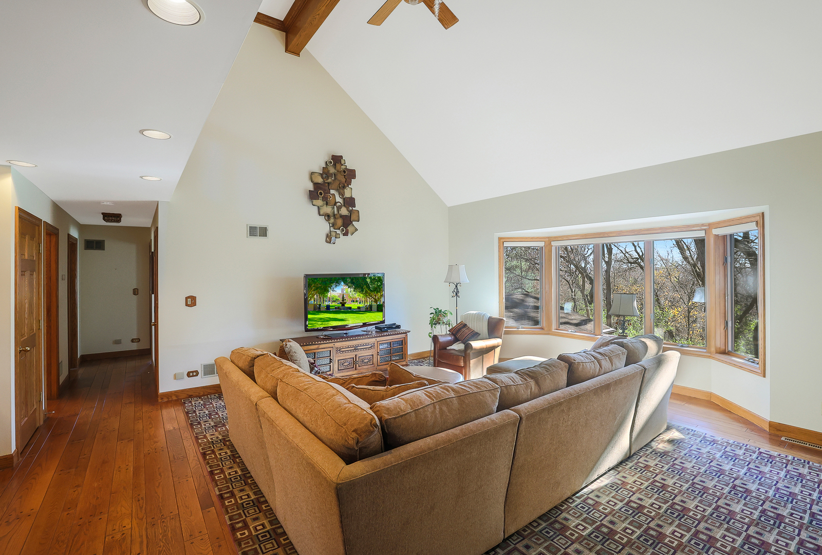 437 High Road Cary, IL 60013 - Photo 12 of 48 a living room with furniture and a flat screen tv
