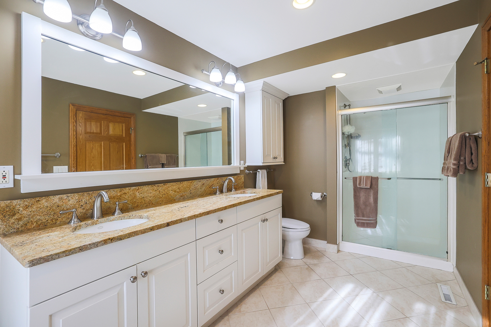 437 High Road Cary, IL 60013 - Photo 18 of 48 a spacious bathroom with a granite countertop sink mirror and toilet