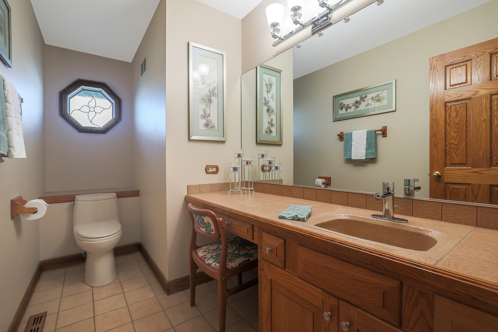 437 High Road Cary, IL 60013 - Photo 21 of 48 a bathroom with a sink toilet and a mirror