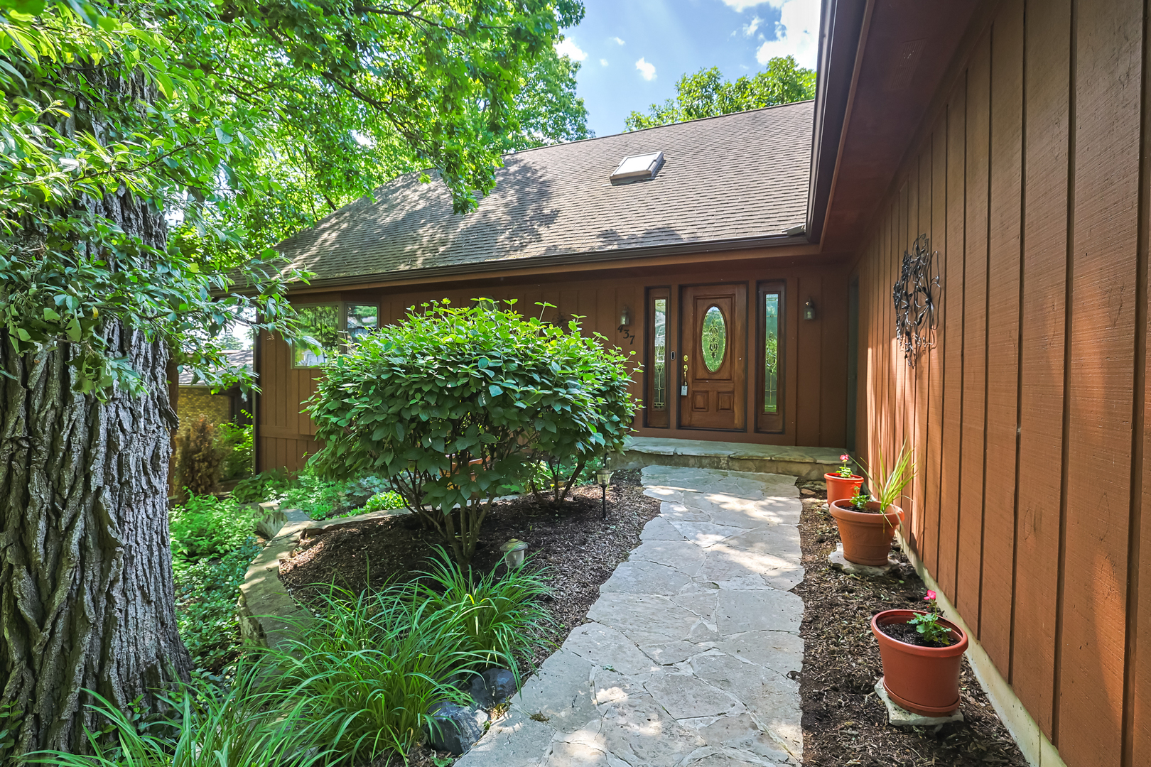 437 High Road Cary, IL 60013 - Photo 3 of 48 a view of a house with potted plants