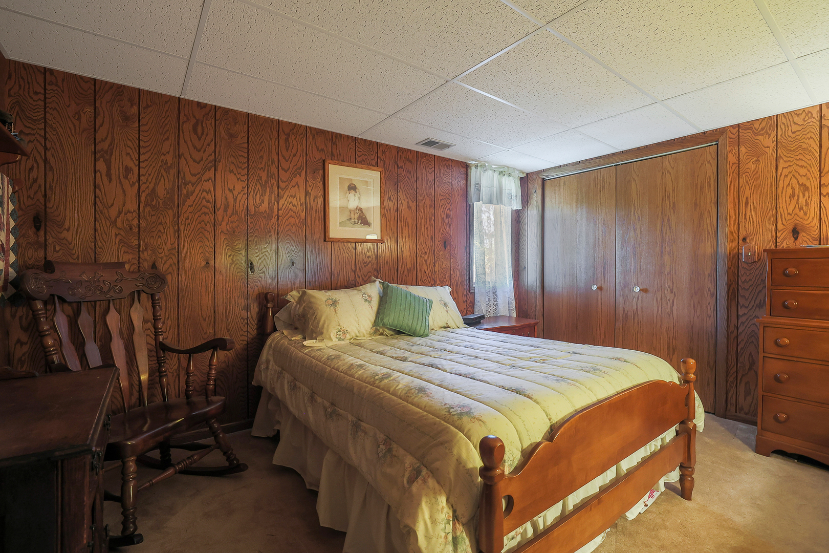 437 High Road Cary, IL 60013 - Photo 31 of 48 a bedroom with a bed a dresser and with the view