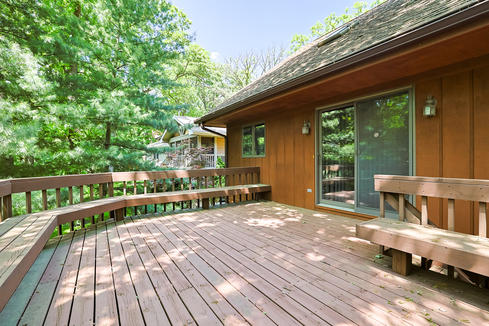 437 High Road Cary, IL 60013 - Photo 35 of 48 a balcony with wooden floor table and chairs