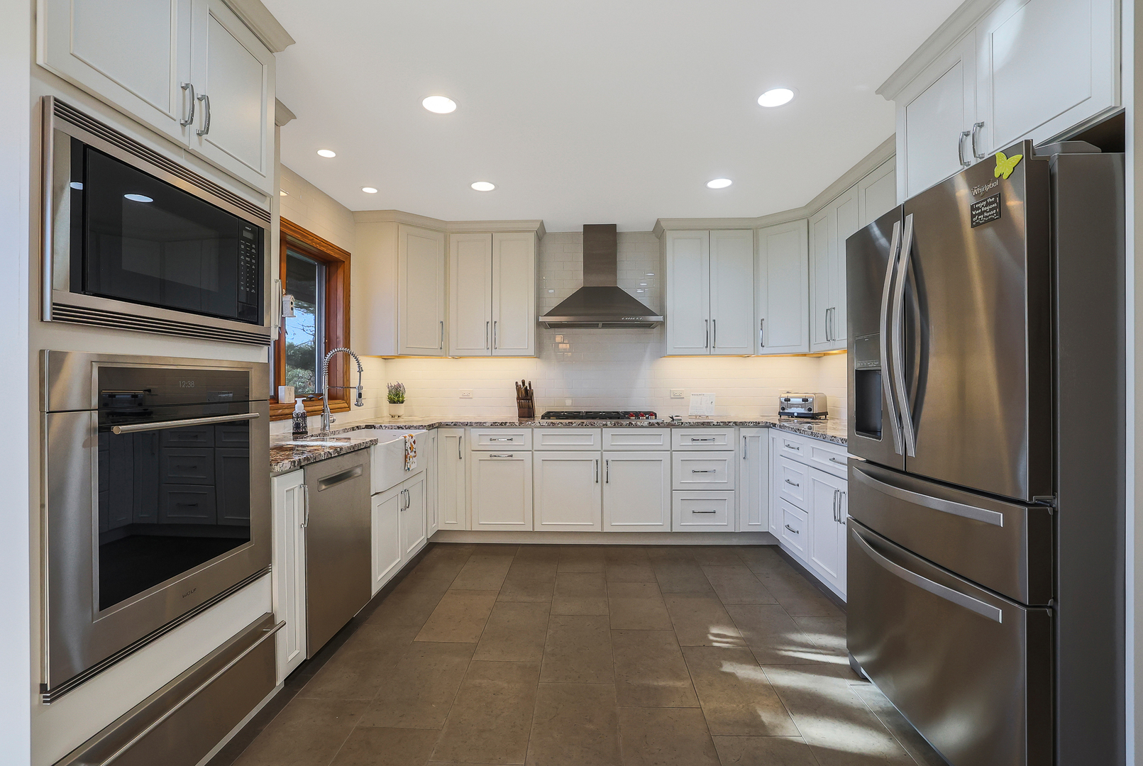 437 High Road Cary, IL 60013 - Photo 6 of 48 a kitchen with granite countertop stainless steel appliances and refrigerator