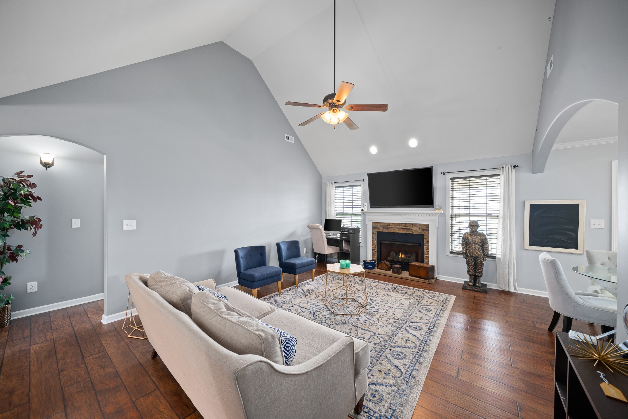 3756 Suiter Road Clarksville, TN 37040 - Photo 5 of 33 a living room with furniture a fireplace and a flat screen tv