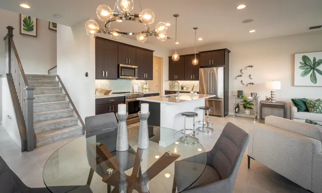 a view of a dining room with furniture wooden floor and chandelier