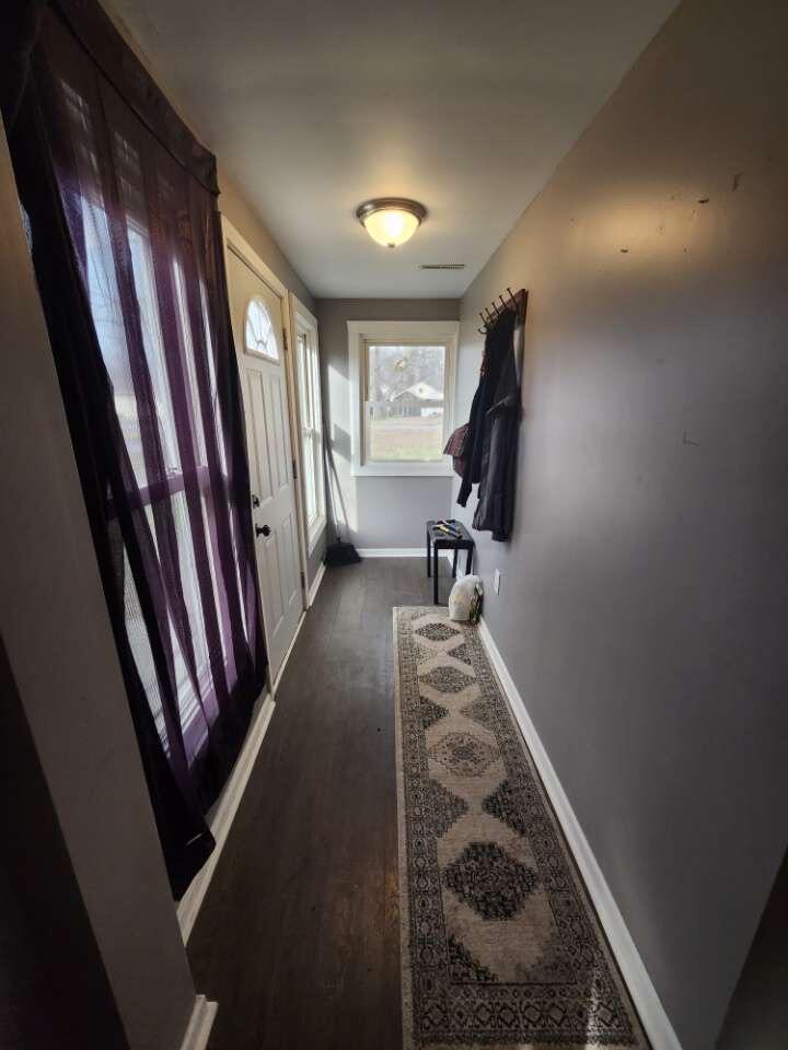 201 East 13th Place Hobart, IN 46342 - Photo 2 of 9 a view of a hallway with furniture and stairs