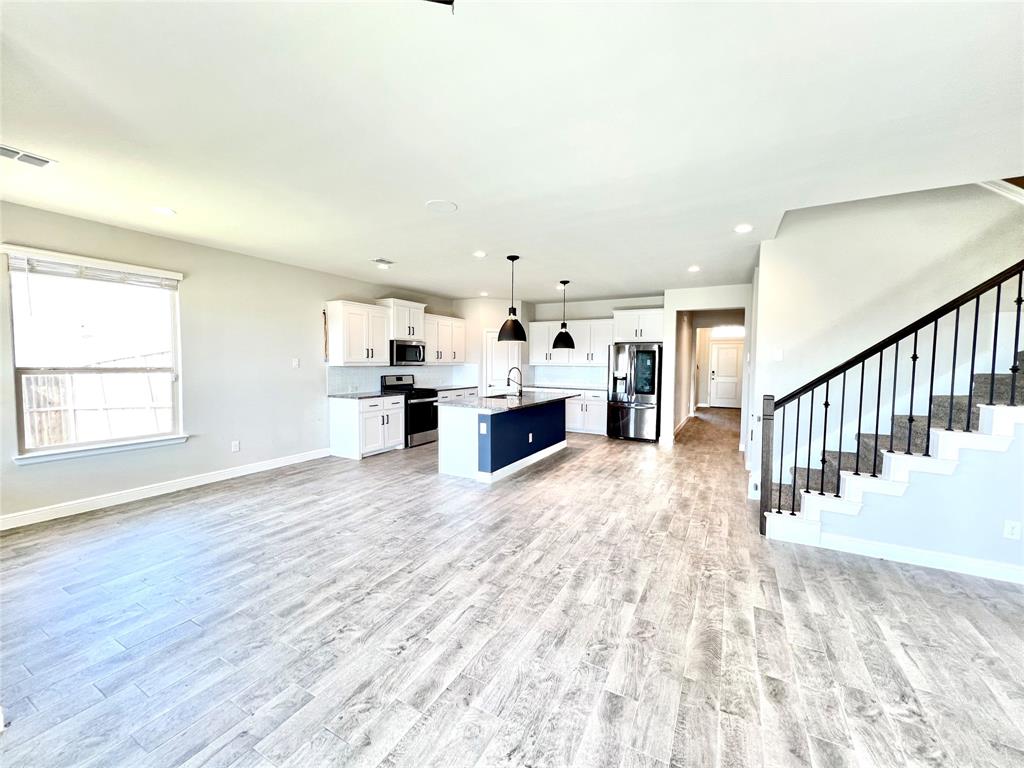 1600 Reed Drive Krum, TX 76249 - Photo 17 of 28 a view of kitchen with furniture and wooden floor