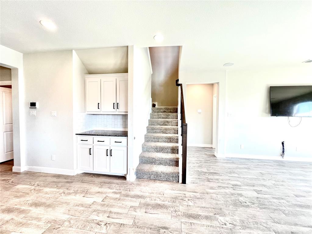 1600 Reed Drive Krum, TX 76249 - Photo 19 of 28 a view of a kitchen with wooden floor and stairs