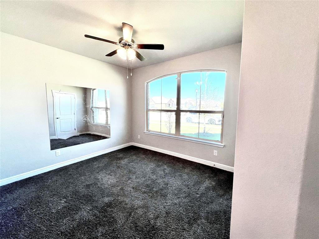 1600 Reed Drive Krum, TX 76249 - Photo 4 of 28 a view of an empty room with a window