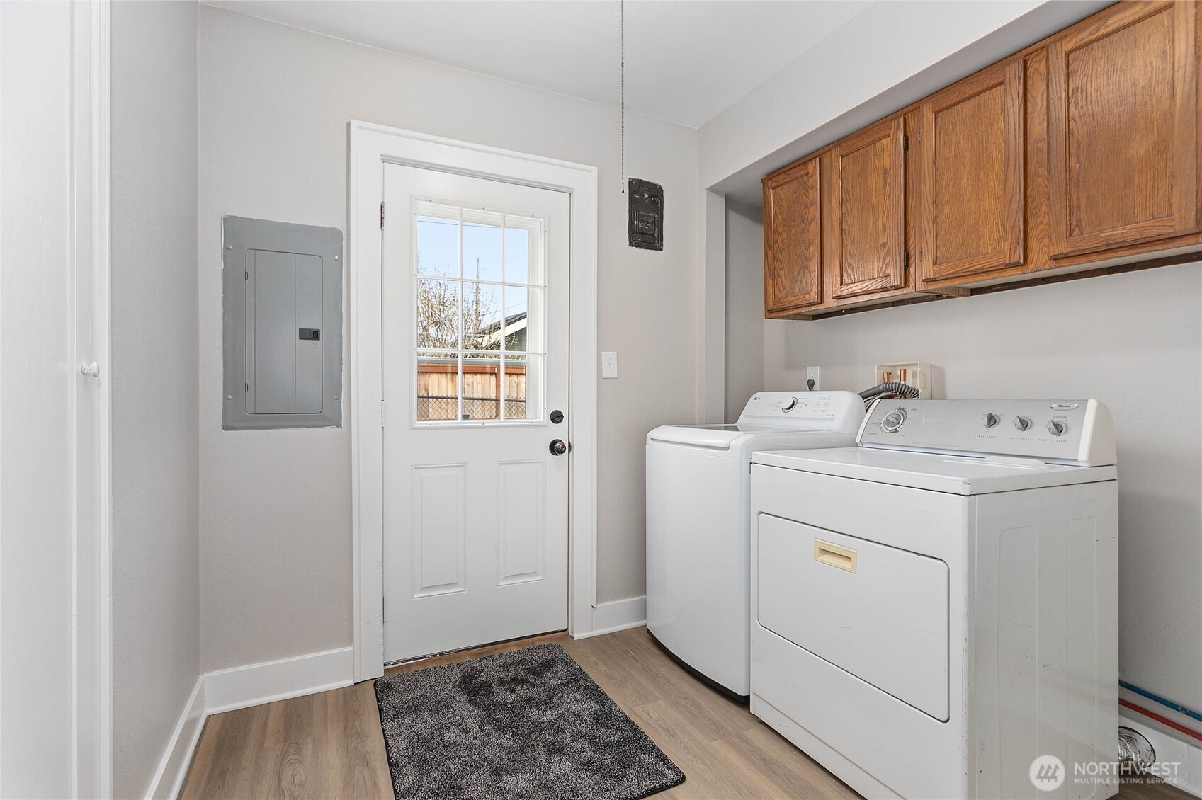 605 Alabama Street Bellingham, WA 98225 - Photo 17 of 27 a utility room with cabinets washer and dryer