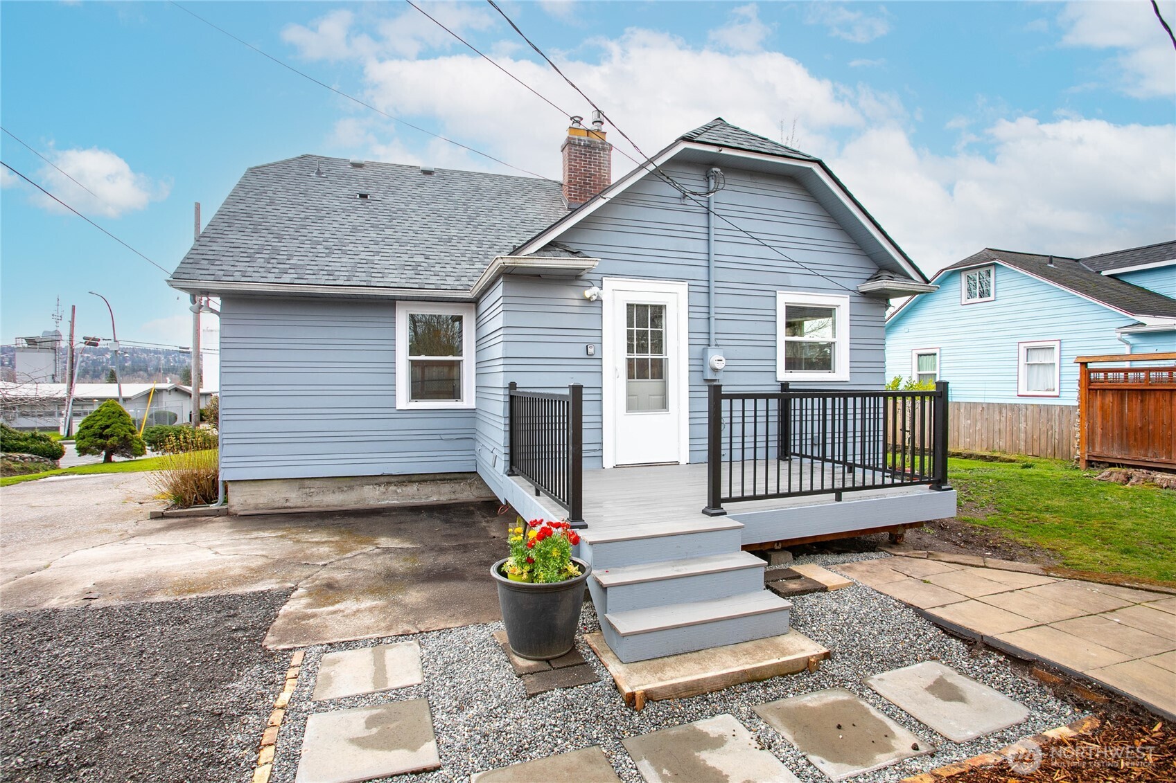 605 Alabama Street Bellingham, WA 98225 - Photo 22 of 27 a view of a house with wooden deck and furniture