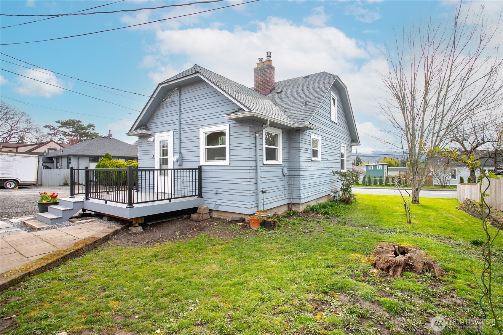 605 Alabama Street Bellingham, WA 98225 - Photo 23 of 27 a view of a house with a yard and sitting area