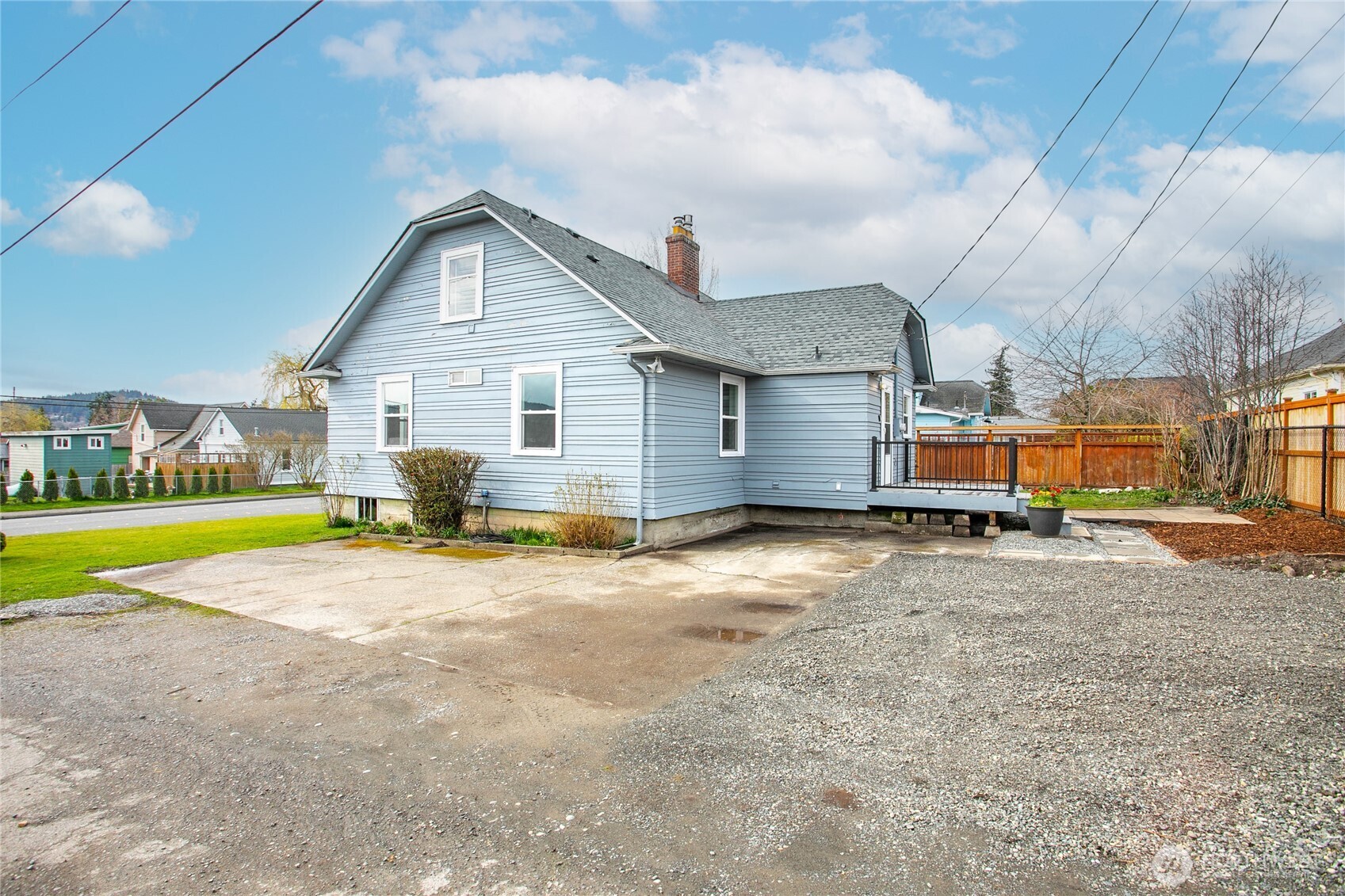 605 Alabama Street Bellingham, WA 98225 - Photo 25 of 27 a view of a house with a swimming pool and a yard