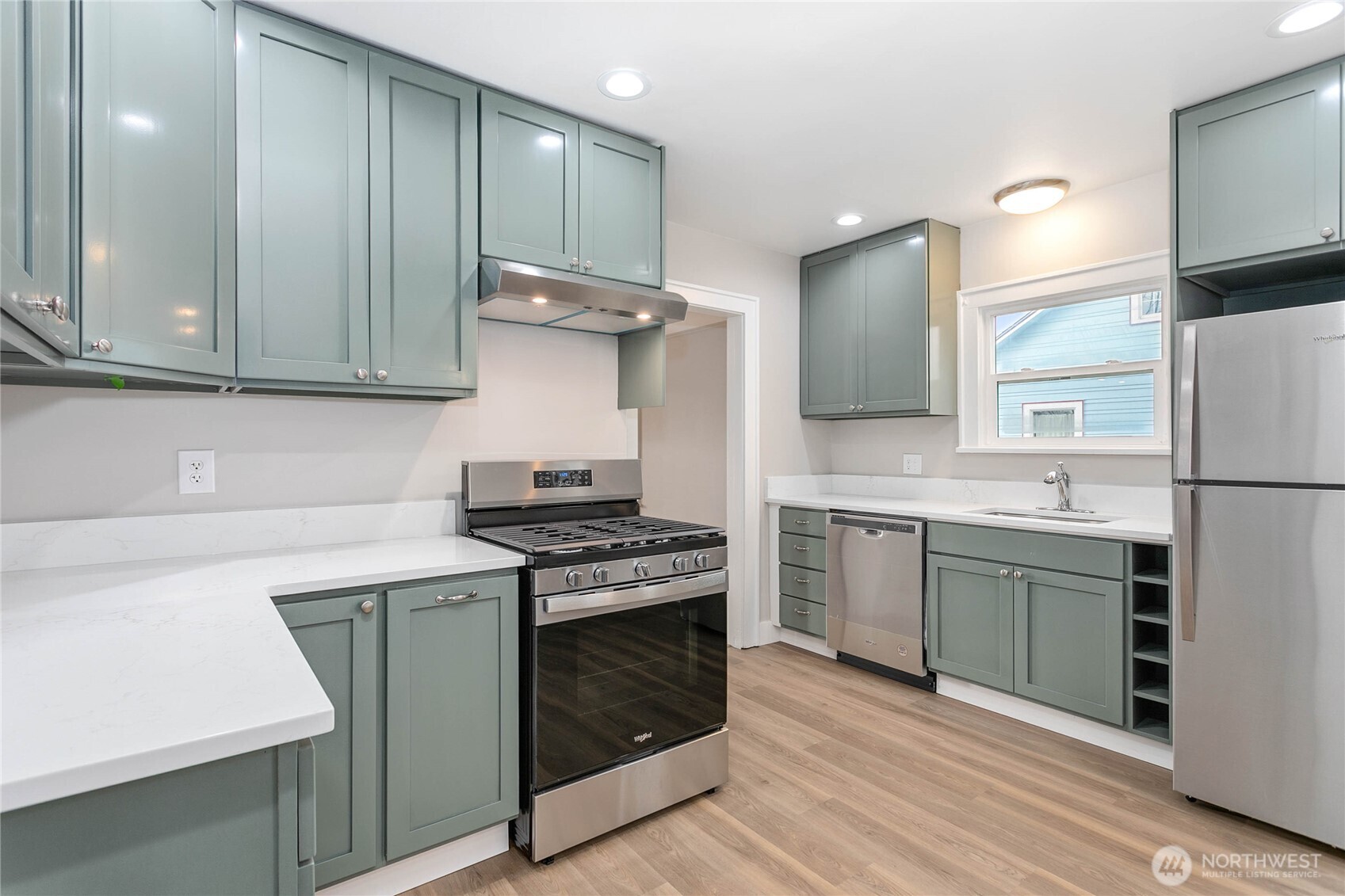 605 Alabama Street Bellingham, WA 98225 - Photo 7 of 27 a kitchen with a stove cabinets and a refrigerator