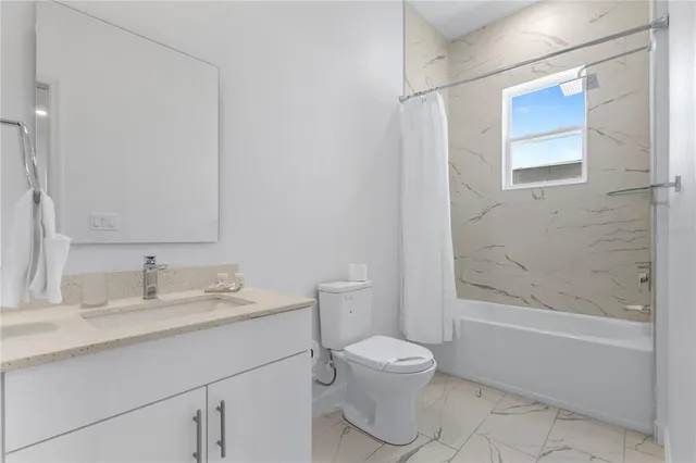 a kitchen with a sink a stove and chairs with kitchen island
