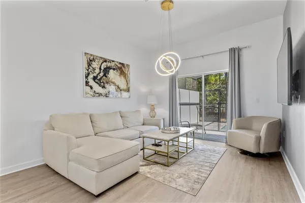 a living room with furniture and a window