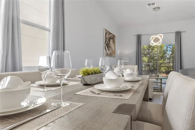 a bedroom with a bed and painting on the wall