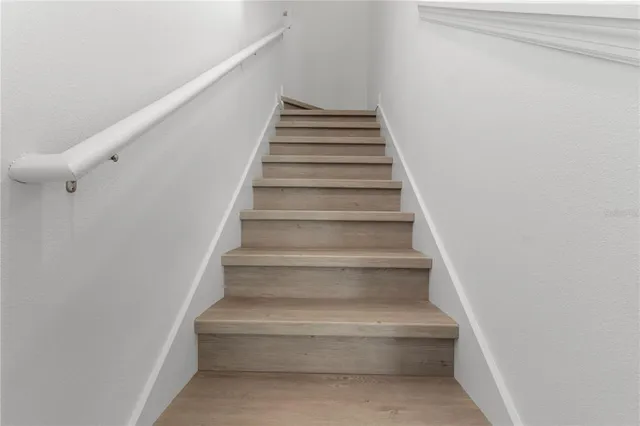a view of a room with furniture and window