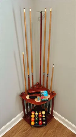 a bedroom with a bed and a mirror on the wall