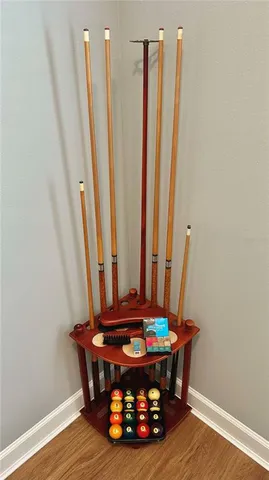 a bedroom with a bed and a mirror on the wall