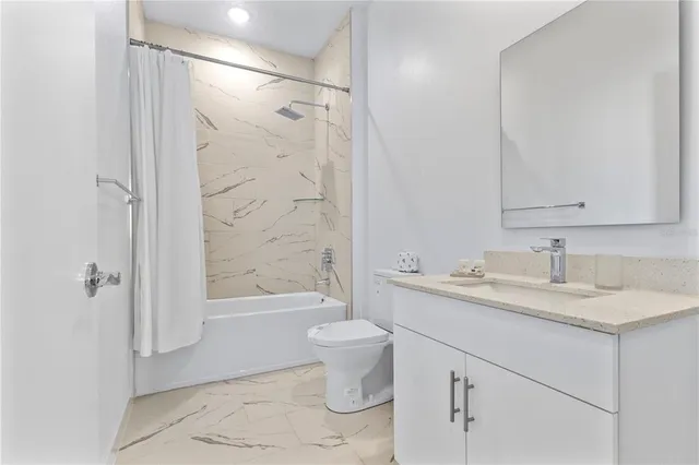 a view of a room with red walls and a potted plant