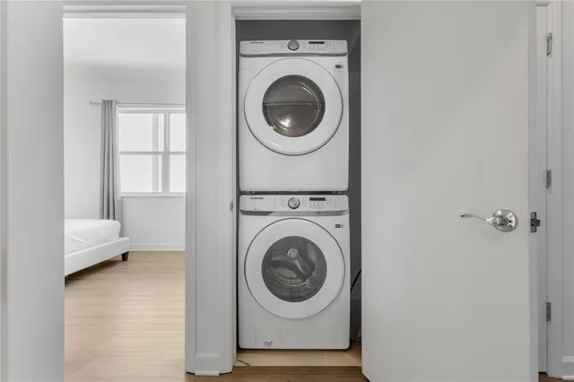 a bedroom with a bed and flat screen tv