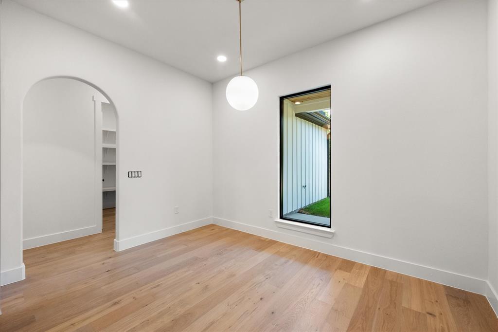 3001 Rock Road Corsicana, TX 75109 - Photo 13 of 40 a view of an empty room with wooden floor and a window