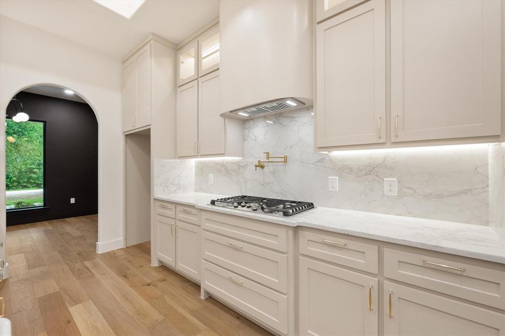 3001 Rock Road Corsicana, TX 75109 - Photo 16 of 40 a kitchen with white cabinets and appliances