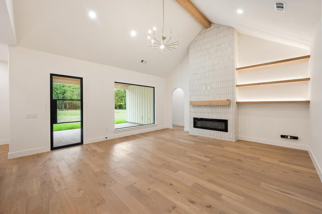 3001 Rock Road Corsicana, TX 75109 - Photo 21 of 40 a view of an empty room with a fireplace and a window