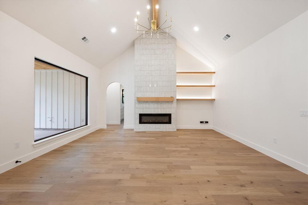 3001 Rock Road Corsicana, TX 75109 - Photo 22 of 40 a view of an empty room with a fireplace and a window