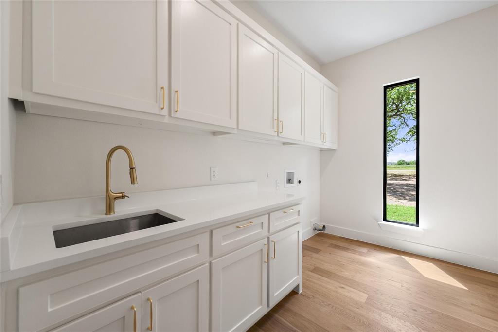 3001 Rock Road Corsicana, TX 75109 - Photo 29 of 40 a kitchen with white cabinets and a window
