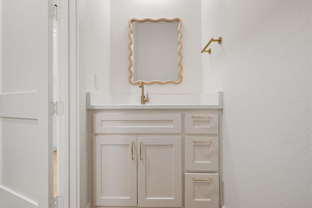 3001 Rock Road Corsicana, TX 75109 - Photo 31 of 40 a bathroom with a sink vanity and mirror
