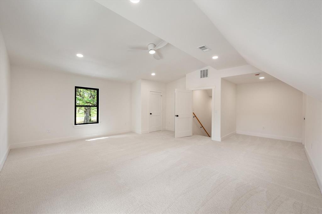 3001 Rock Road Corsicana, TX 75109 - Photo 32 of 40 an empty room with windows and a ceiling fan