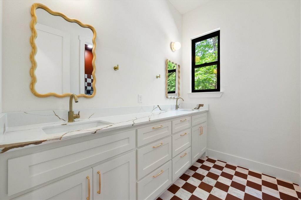 3001 Rock Road Corsicana, TX 75109 - Photo 36 of 40 a bathroom with a double vanity sink and mirror
