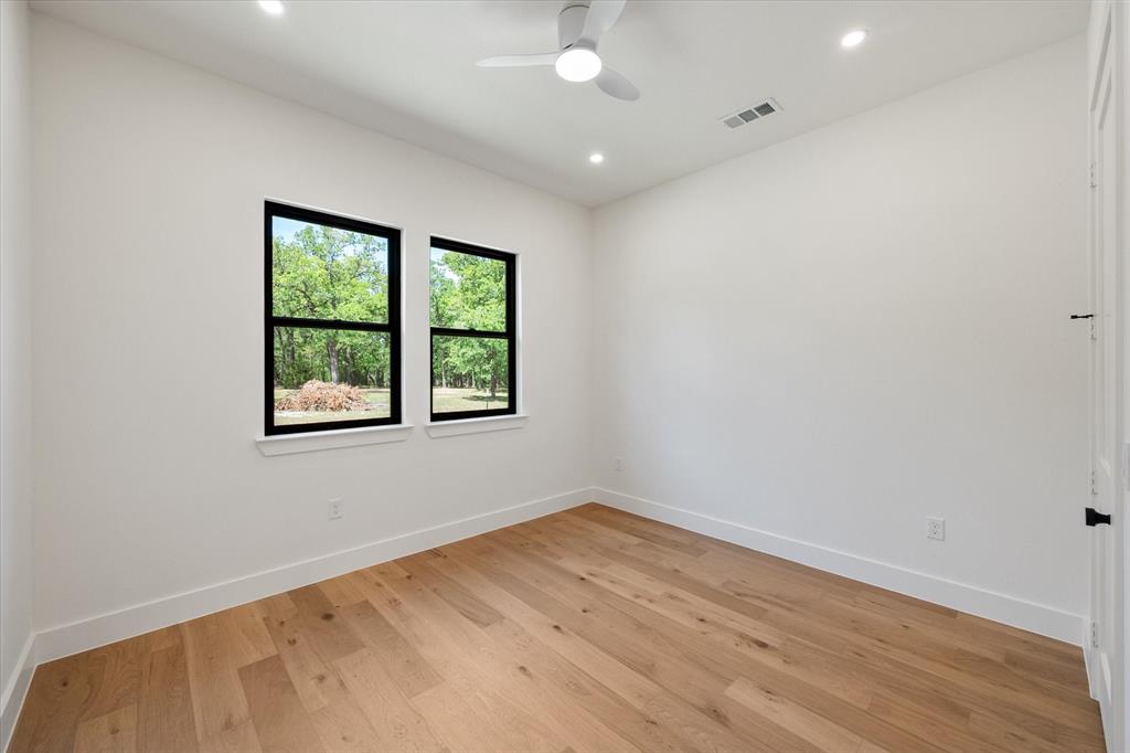 3001 Rock Road Corsicana, TX 75109 - Photo 37 of 40 an empty room with wooden floor and windows