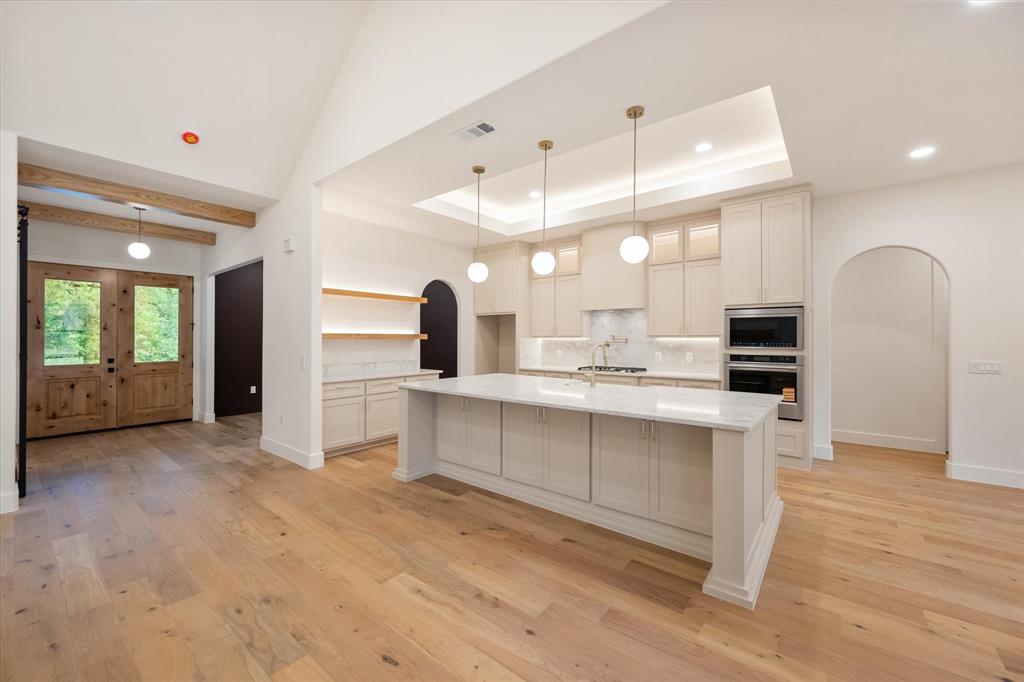 3001 Rock Road Corsicana, TX 75109 - Photo 8 of 40 a large white kitchen with a sink stainless steel appliances and cabinets